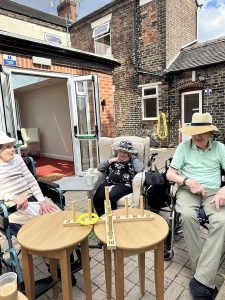 Residents at Westcroft Nursing Home- enjoying sun outside in the garden